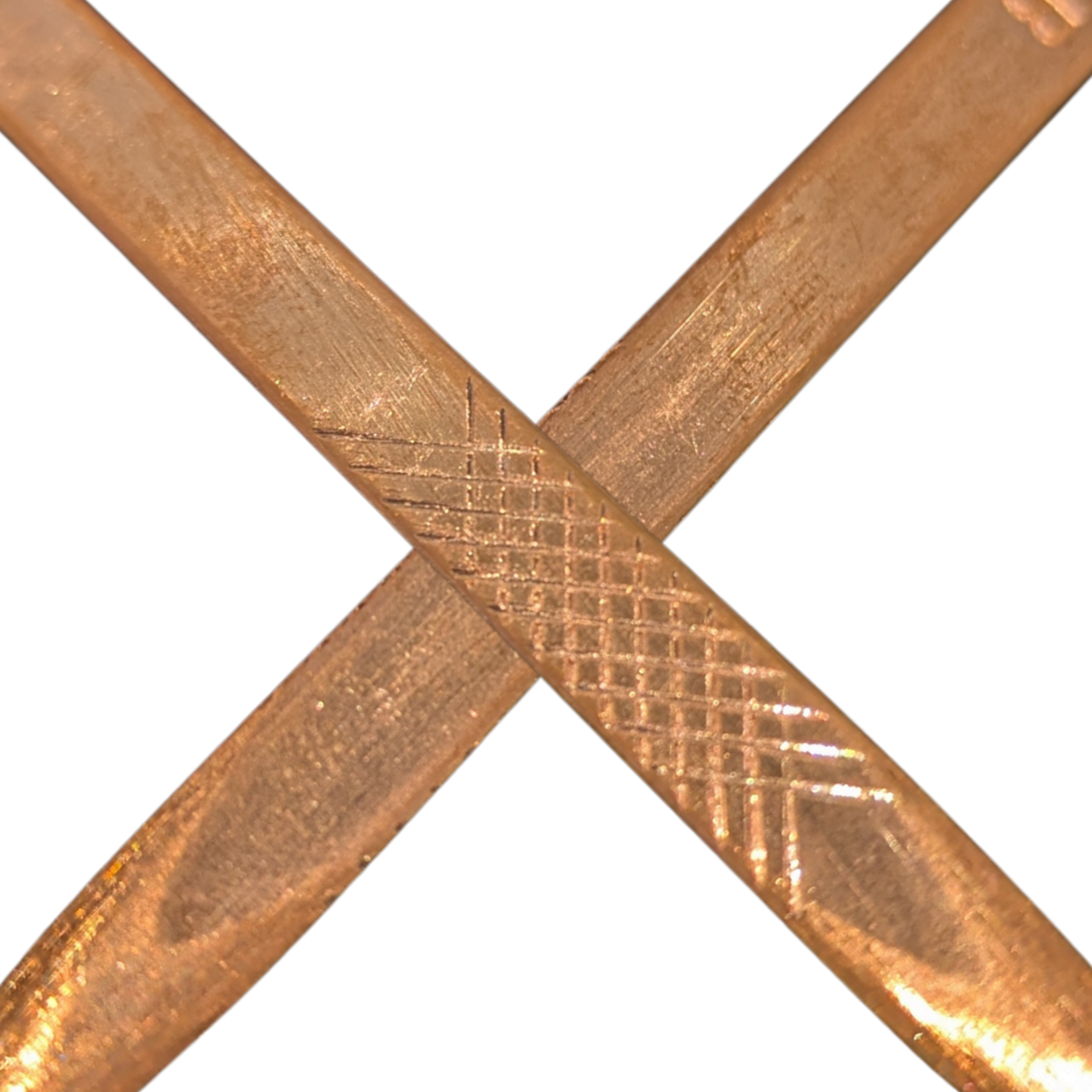 Two crossed bronze nails on a white background
