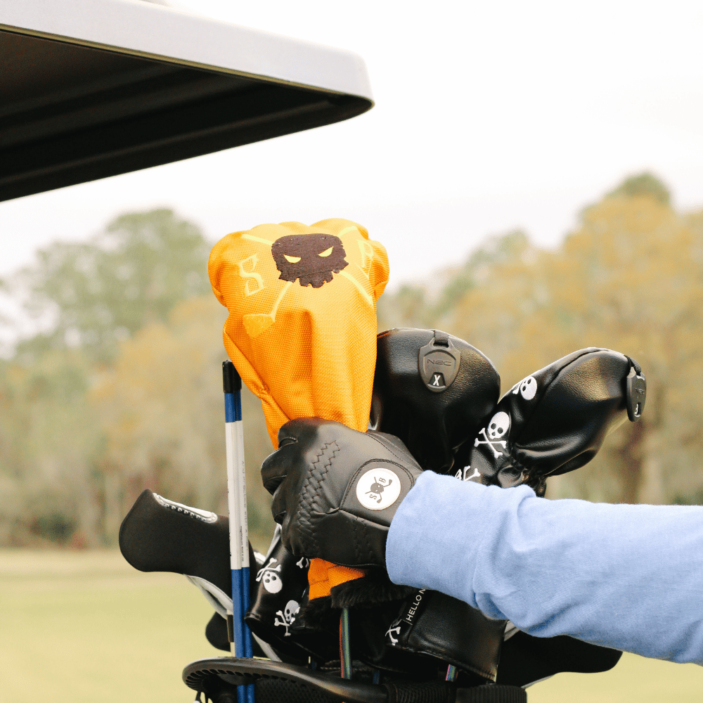 Golden Ingot Waterproof Driver Headcover in gold, on a driver in the bag