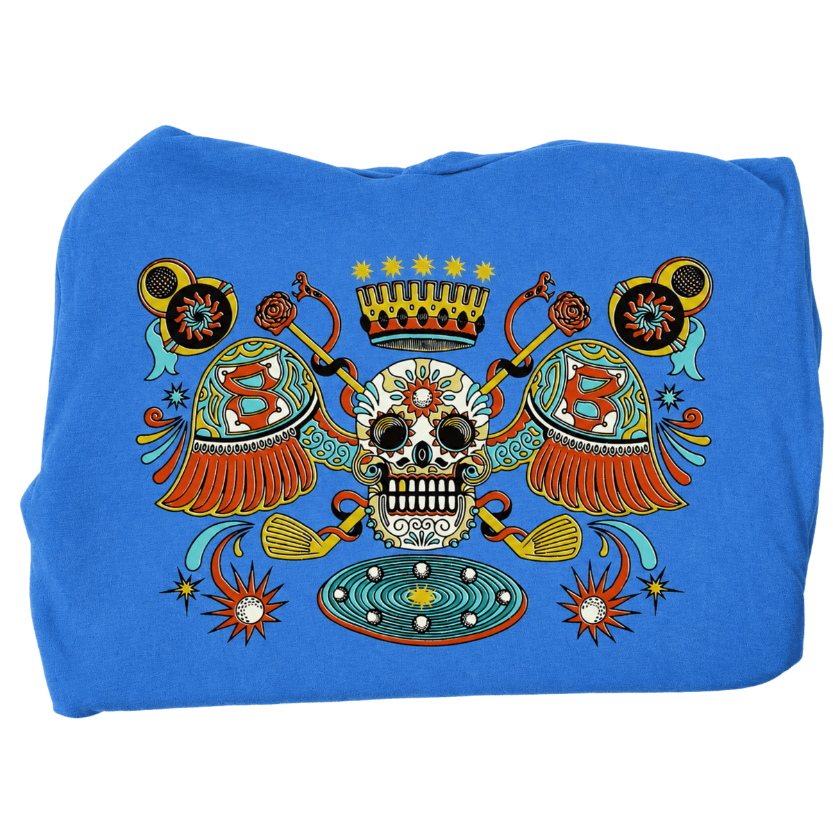 A folded blue sweatshirt or hoodie featuring a large, colorful Day of the Dead (Dia de los Muertos) style graphic print on the front. The graphic includes a central sugar skull, a crown, two crossed rifles, ornate shields with the letter 'B', and decorative stars and geometric patterns in red, yellow, green, and white.