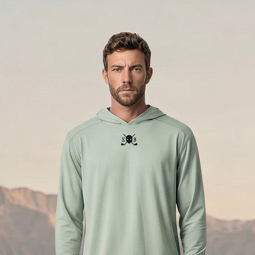 Man standing on a mountain with mountains in the background