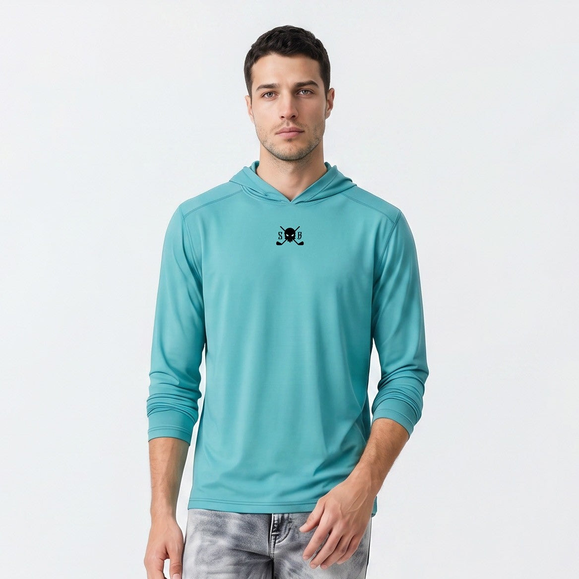 Man wearing a teal hoodie and gray jeans on a white background