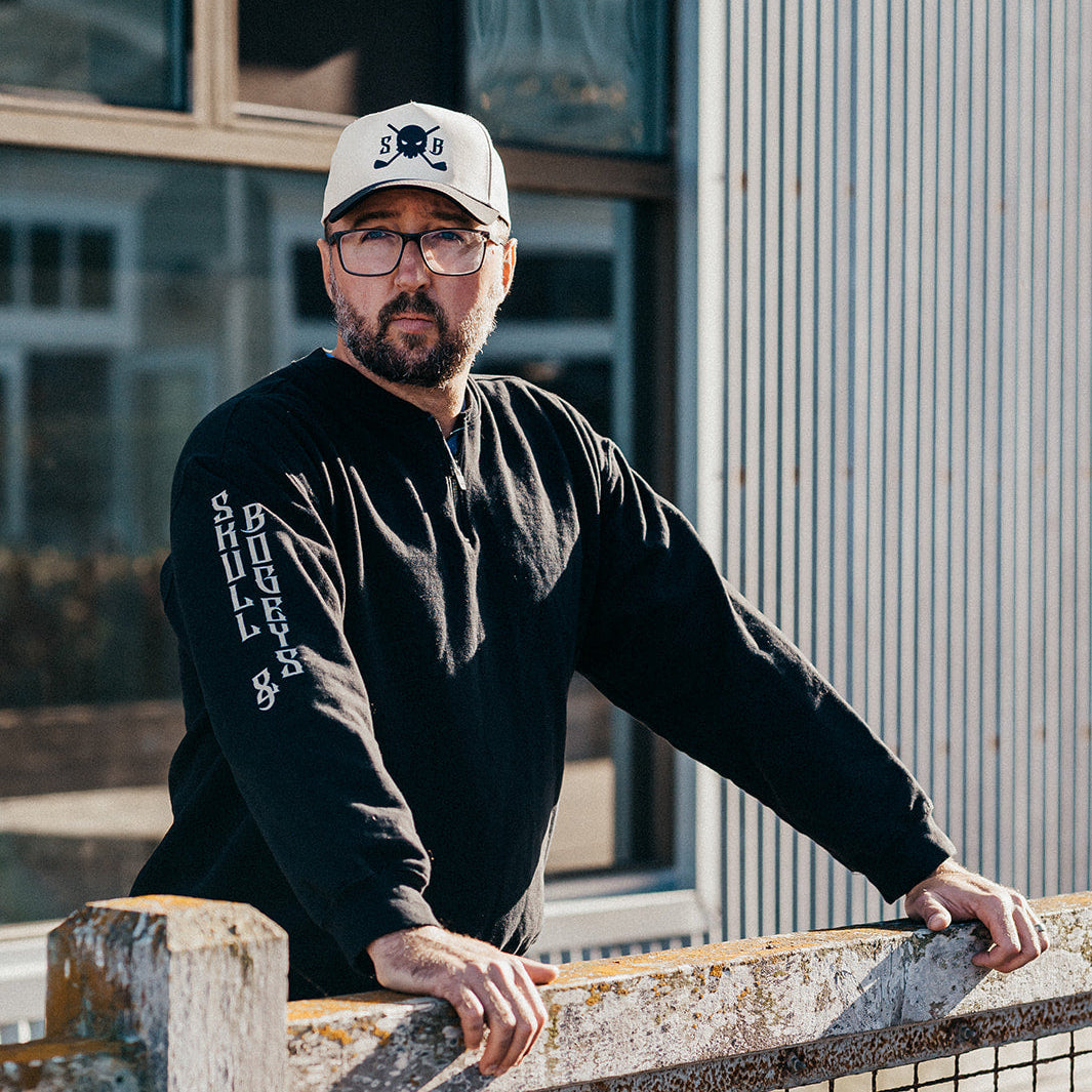 Skull & Bogeys Obsidian Stealth black midweight quarter-zip pullover, front view