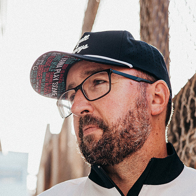 Skull & Bogeys black golf snapback hat with white script embroidery and white rope