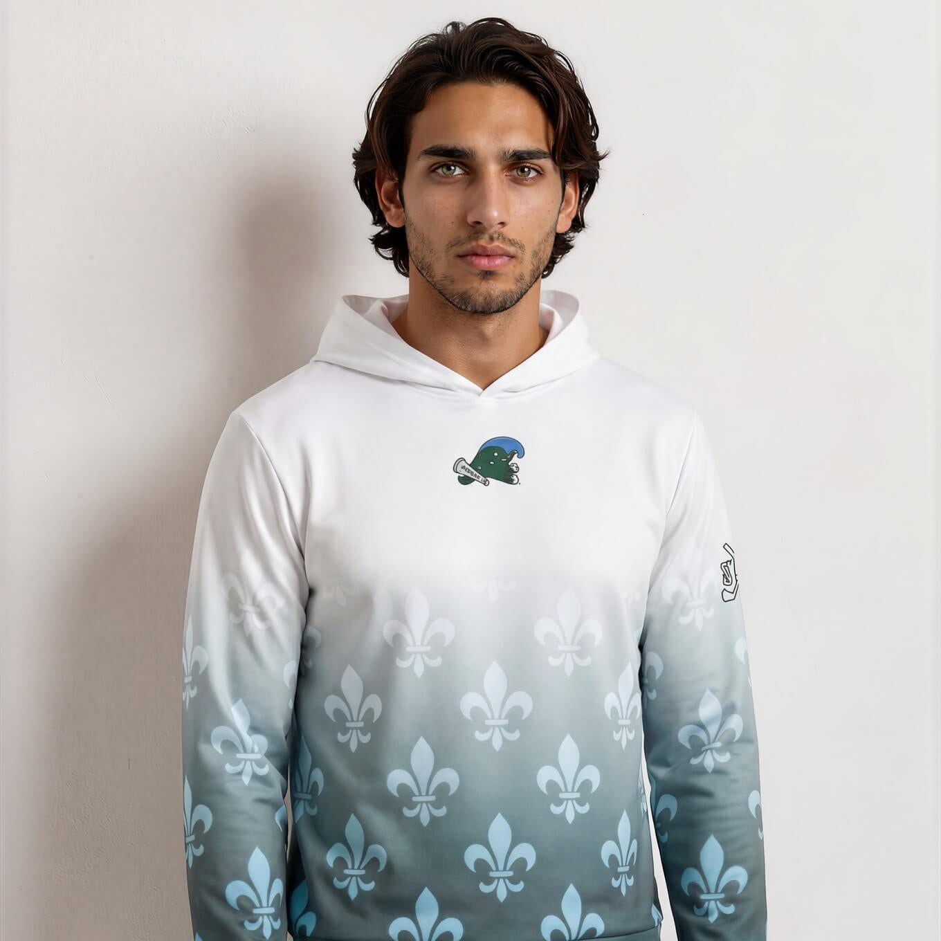 Man wearing a gradient hoodie with a logo on a plain background
