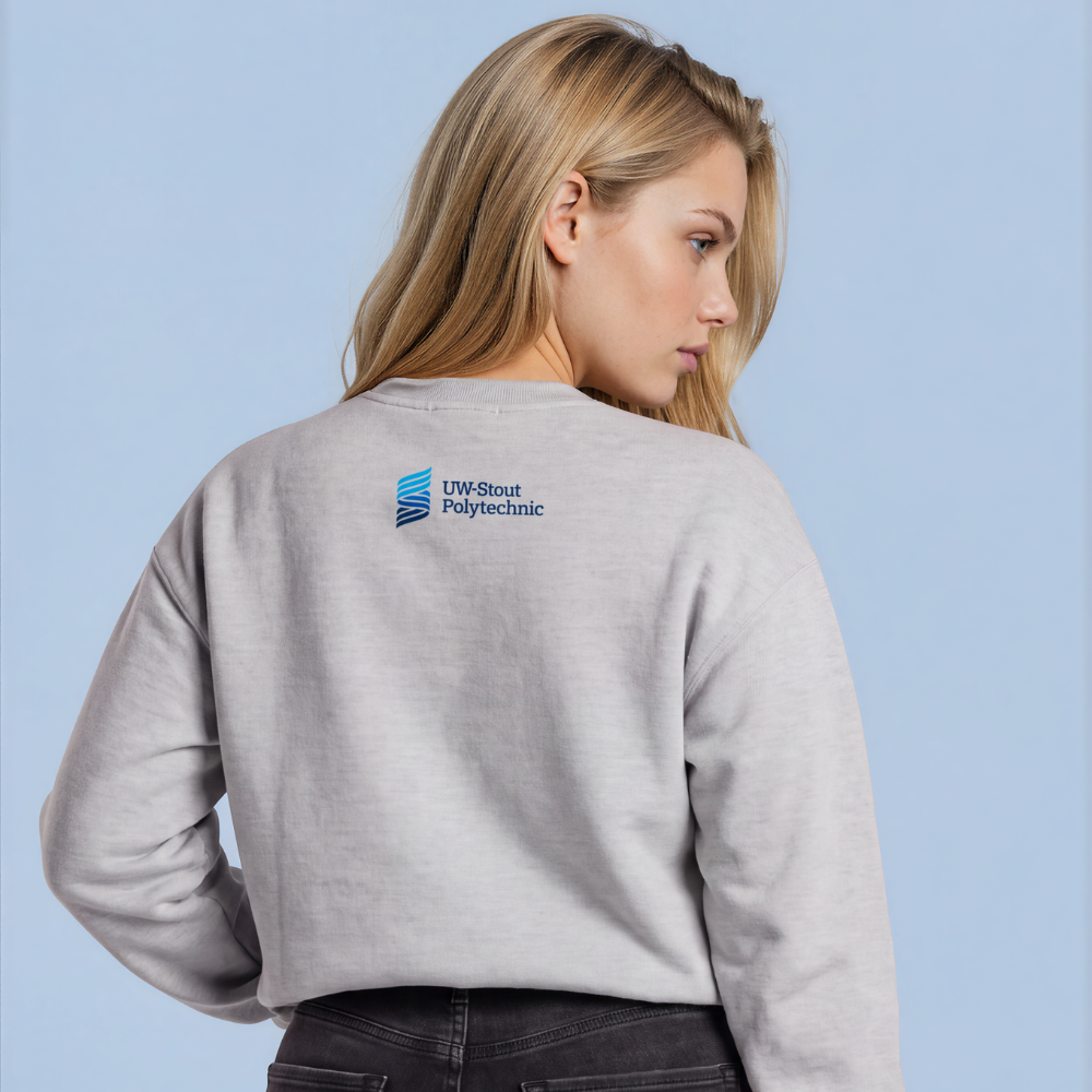 A woman shown from the back wearing a light gray crewneck sweatshirt with a blue and white '1246 Street Polytechnic' logo on the upper back, paired with dark gray jeans, against a solid light blue background.