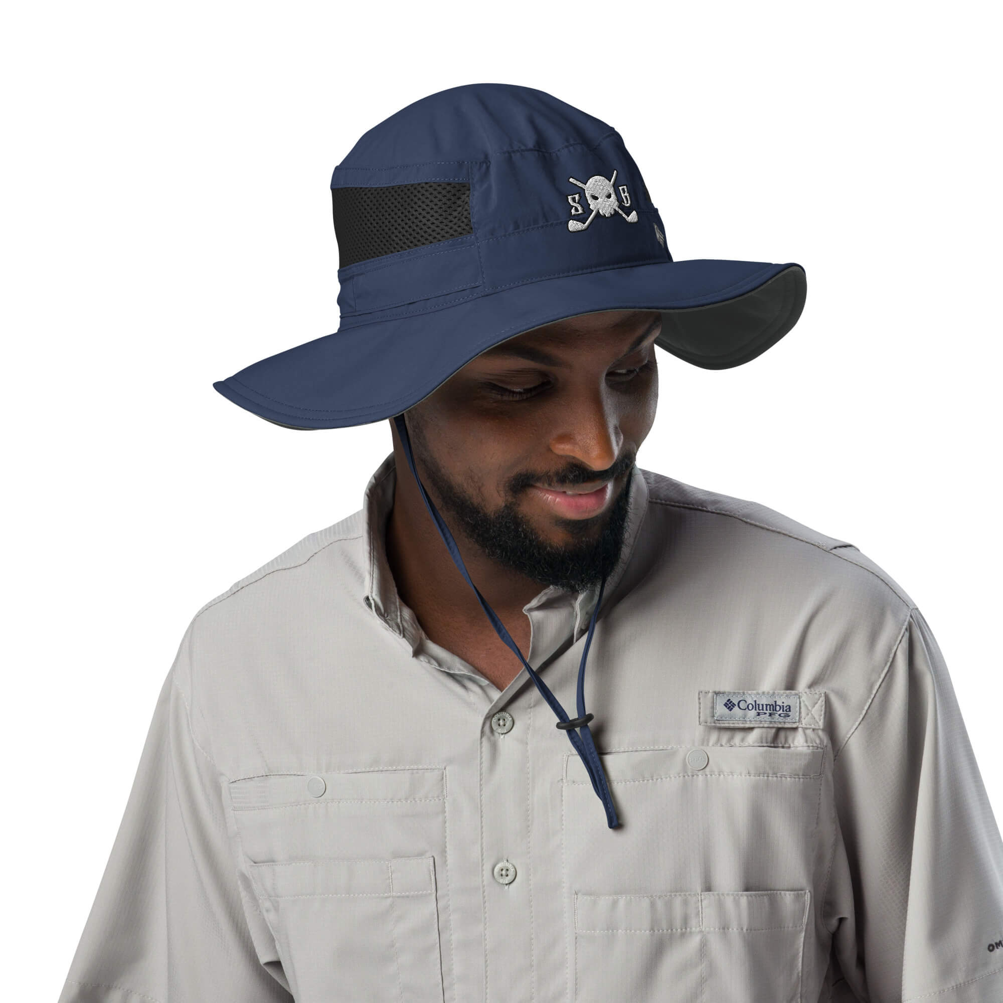 Man wearing a Skull & Bogeys Golf Co. blue wide-brimmed hat with a Columbia logo on a white background