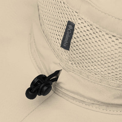 Beige hat with Columbia logo and chin strap on a beige background