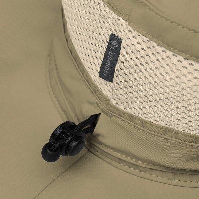 Close-up of a beige Columbia hat with a mesh back and black chin strap.