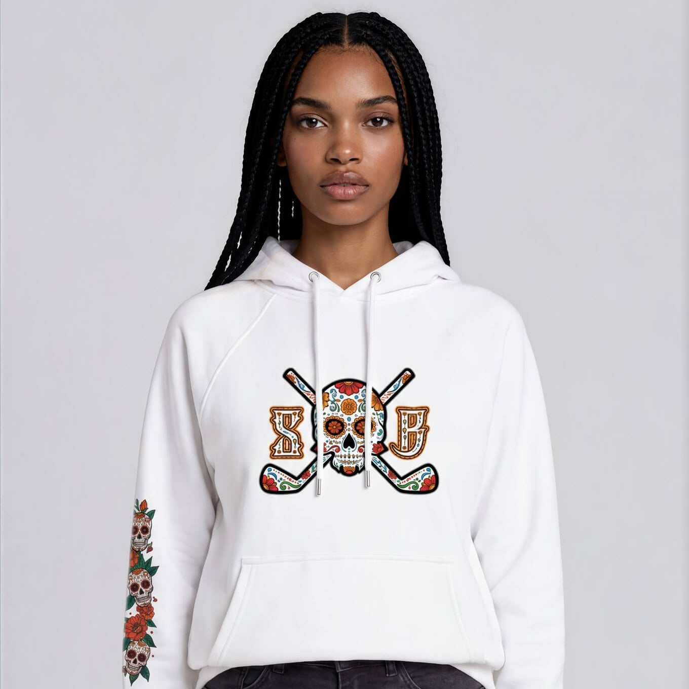 Person wearing a white hoodie with a colorful design on a gray background