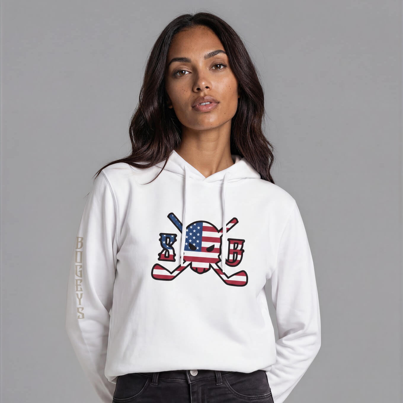 Woman wearing a white hoodie with a graphic design on a gray background